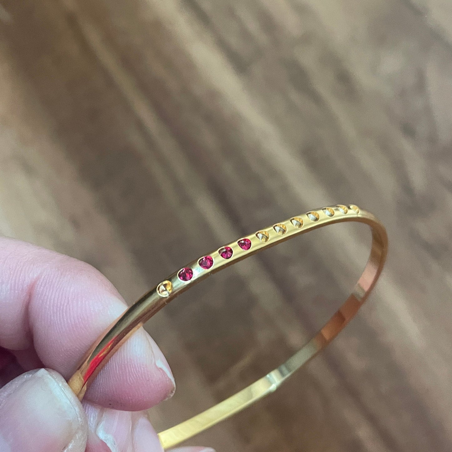 5 Gold Plated 1/8" wide domed bangle is oval shaped w/twelve 13pp cavities