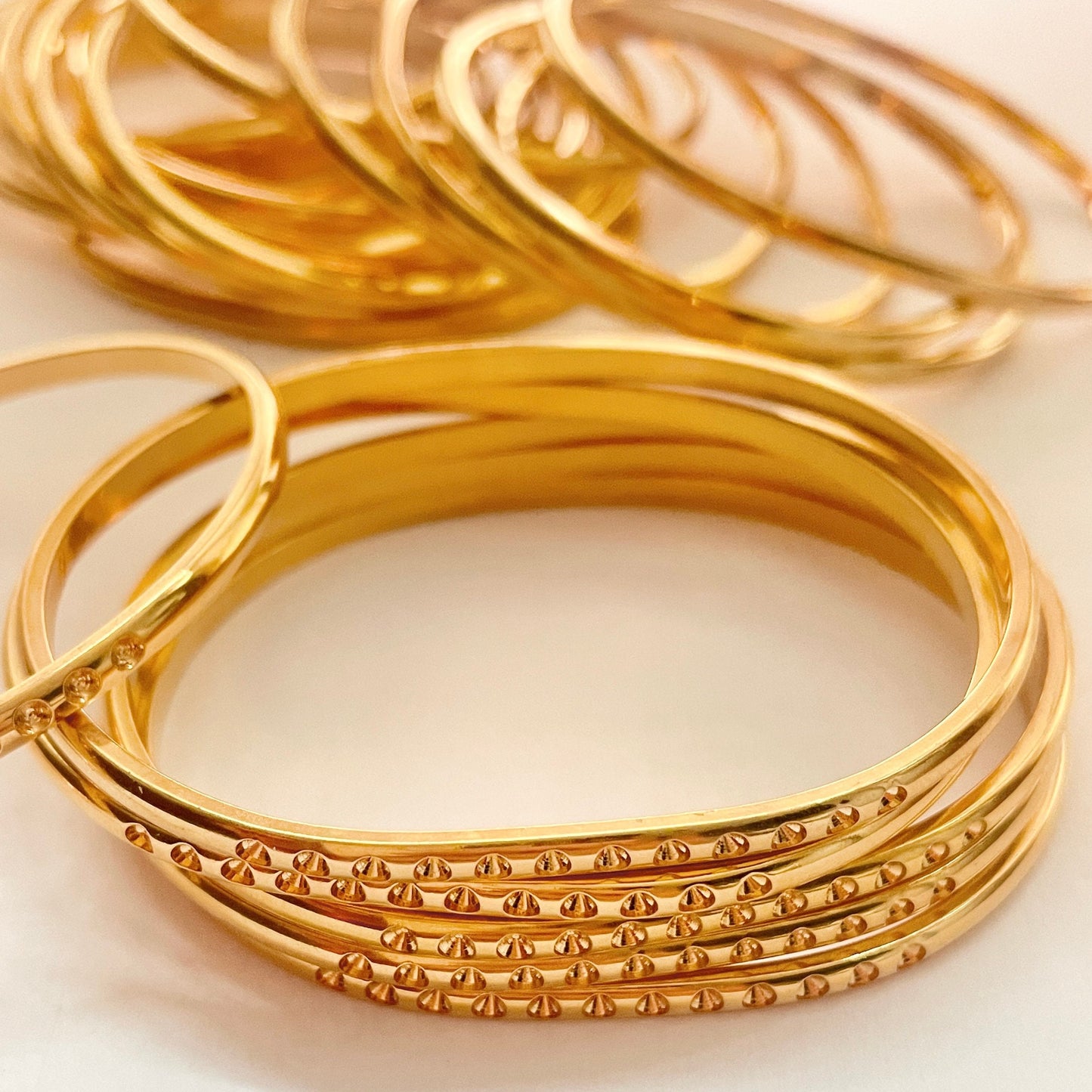 5 Gold Plated 1/8" wide domed bangle is oval shaped w/twelve 13pp cavities